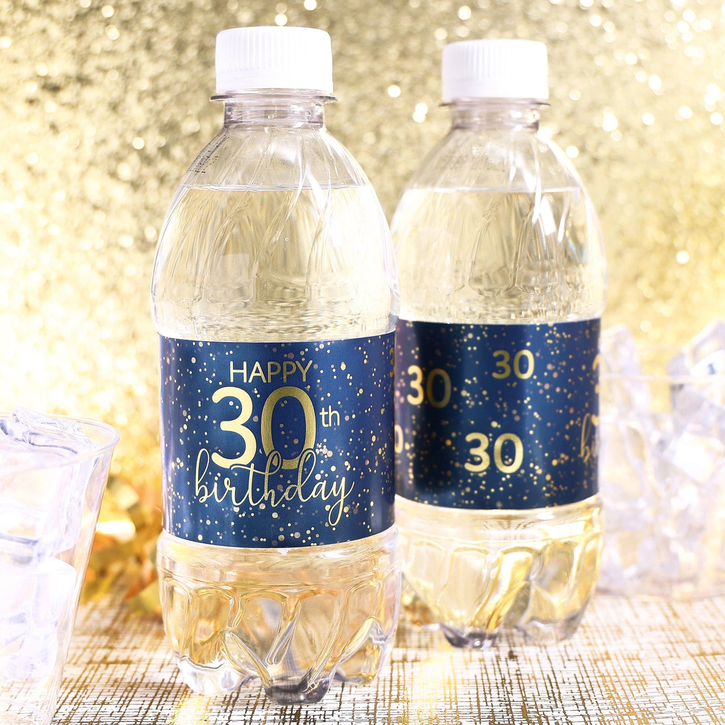 A close-up view of a navy blue water bottle label with gold lettering that reads "Happy 30th Birthday" and features a sleek, modern design.