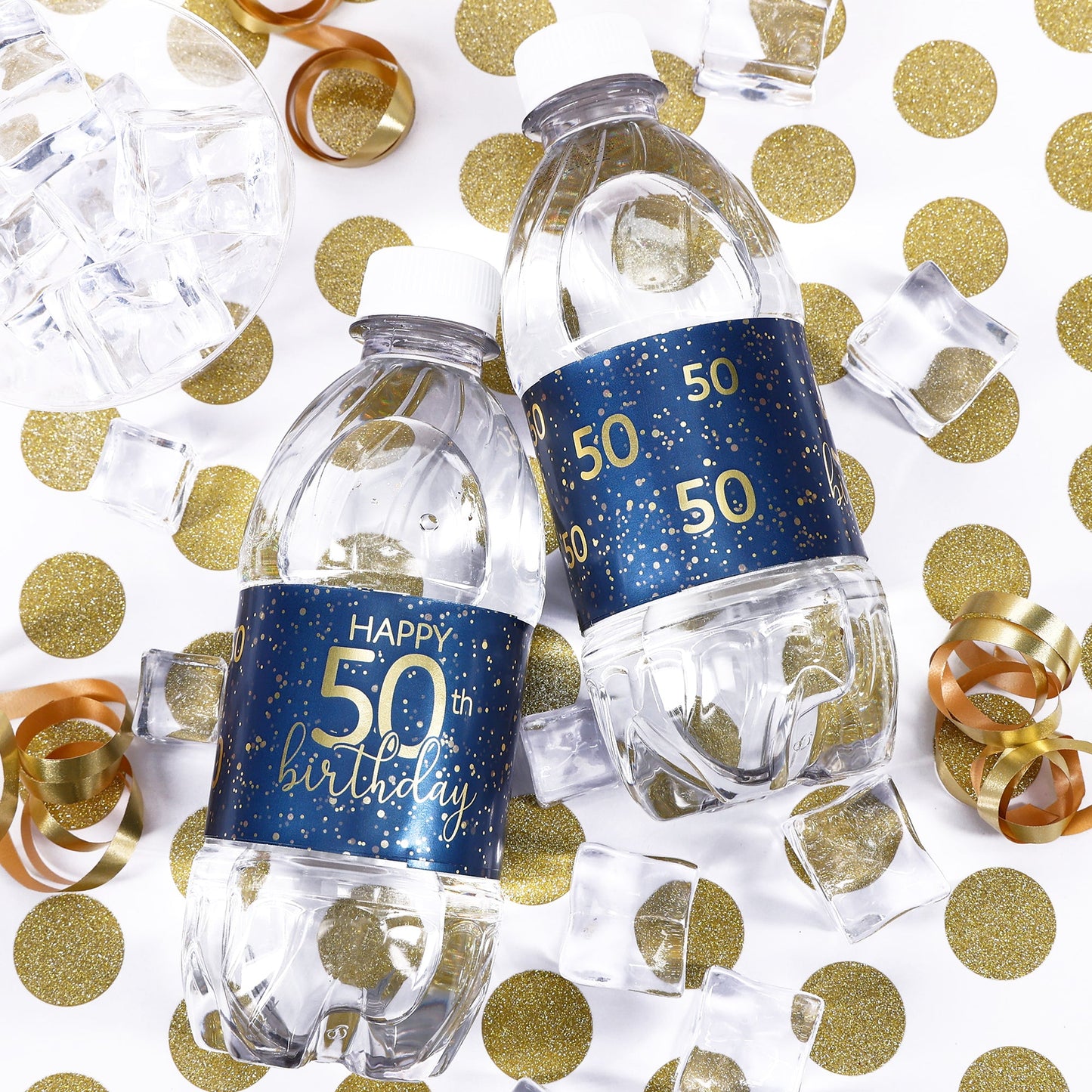 A group of water bottles with elegant navy blue and gold labels that are customized for an 50th birthday celebration, perfect for adding a personalized touch to any party