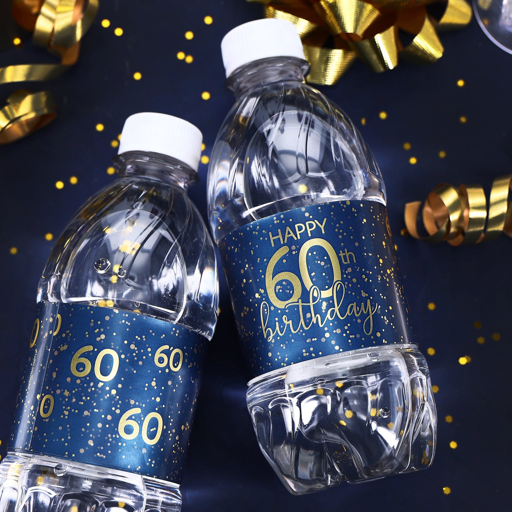 A group of water bottles with elegant navy blue and gold labels that are customized for an 60th birthday celebration, perfect for adding a personalized touch to any party