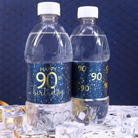 A group of water bottles with elegant navy blue and gold labels that are customized for an 90th birthday celebration, perfect for adding a personalized touch to any party