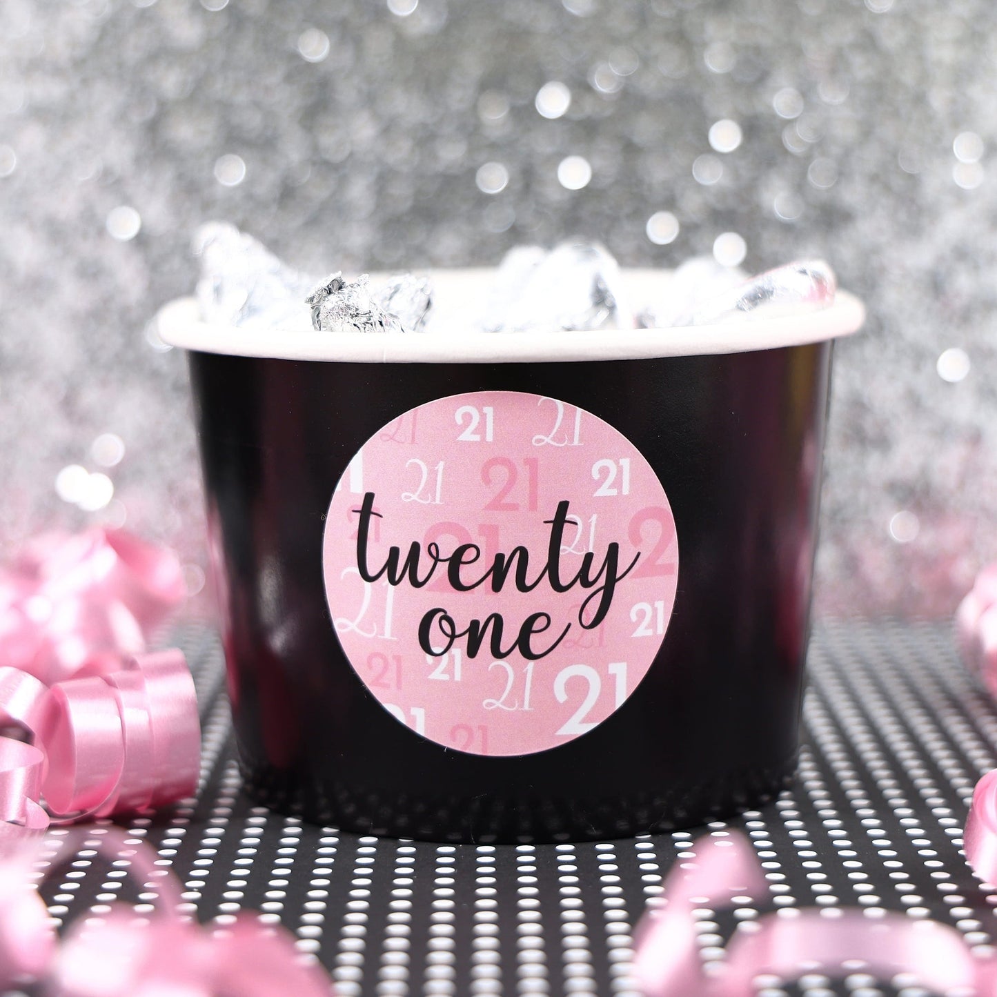 A close-up of a pink and black 21st birthday sticker with a stylish design, made in the USA and perfect for celebrating a milestone birthday.
