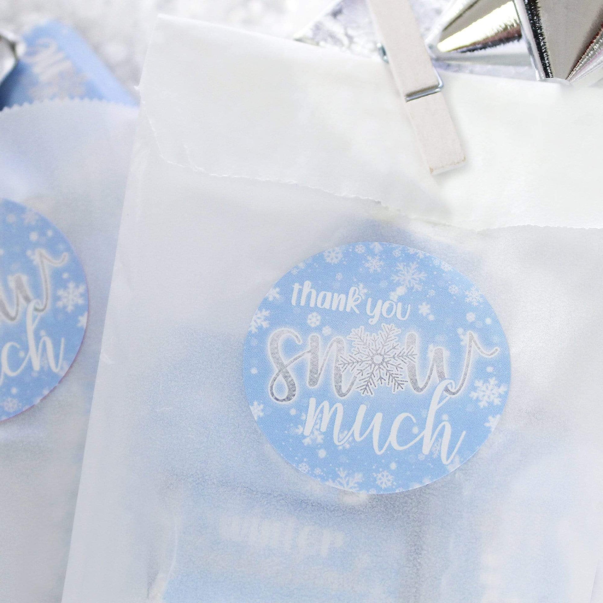 Add a special touch to your winter wonderland 1st birthday party with these Snow Much stickers
