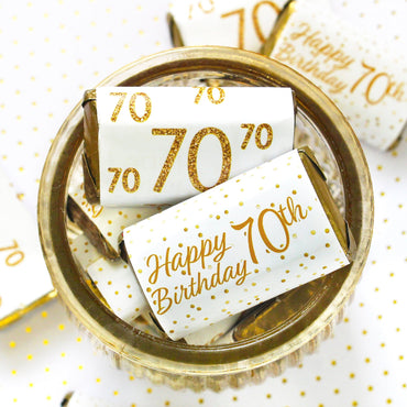 Treat your guests to the sweetest 70th birthday gift with these white and gold mini candy bar stickers